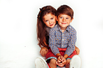 little cute boy and girl hugging playing on white background, happy smiling family, lifestyle people concept