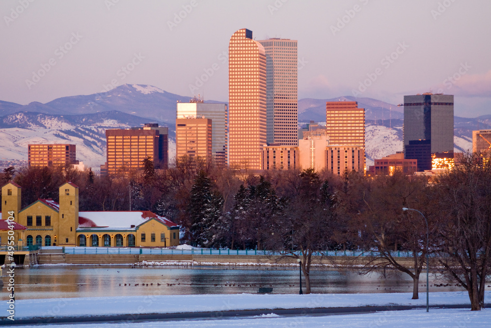 Sunrise turns downtown Denver high rises a golden color as the ...