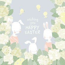 Cute Easter Bunnies With Easter Eggs In Hydrangea Bushes