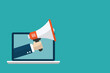 © Yellow duck - megaphone in  hand coming out from of laptop. copy space for text. isolated on blue background. vector illustration flat design. loudspeaker promotion online.