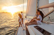 © Spotmatik - Latino family with luxury lifestyle sailing at sunset
