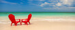 © Spotmatik - Panoramic red travel chairs on white sandy beach