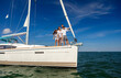 © Spotmatik - Latino family enjoying sailing vacation on private yacht