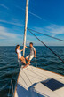 © Spotmatik - Latin American couple enjoying leisure time on yacht