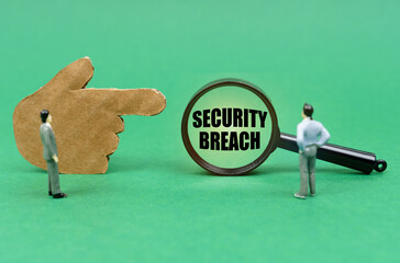 Aufkleber - On a green surface, a hand, figurines of people and a magnifying glass with the inscription - Security Breach