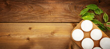 White Eggs In A Wooden Stand On A Wooden Background
