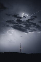 TV tower at night during a thunderstorm