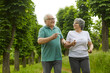 © Studio Romantic - Senior mature retired couple jogging in green park. Active healthy cheerful smiling aged elderly people running in forest exercise together to stop aging. Fitness and workout on retirement for health