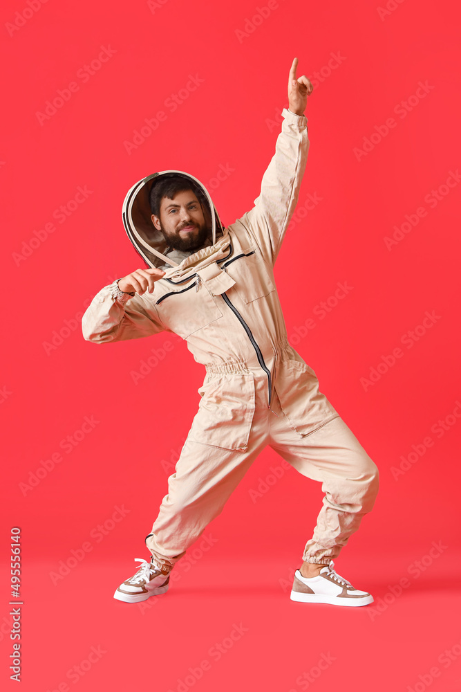 Dancing beekeeper on red background