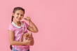 © Pixel-Shot - Little girl with cute guinea pig in bag on pink background