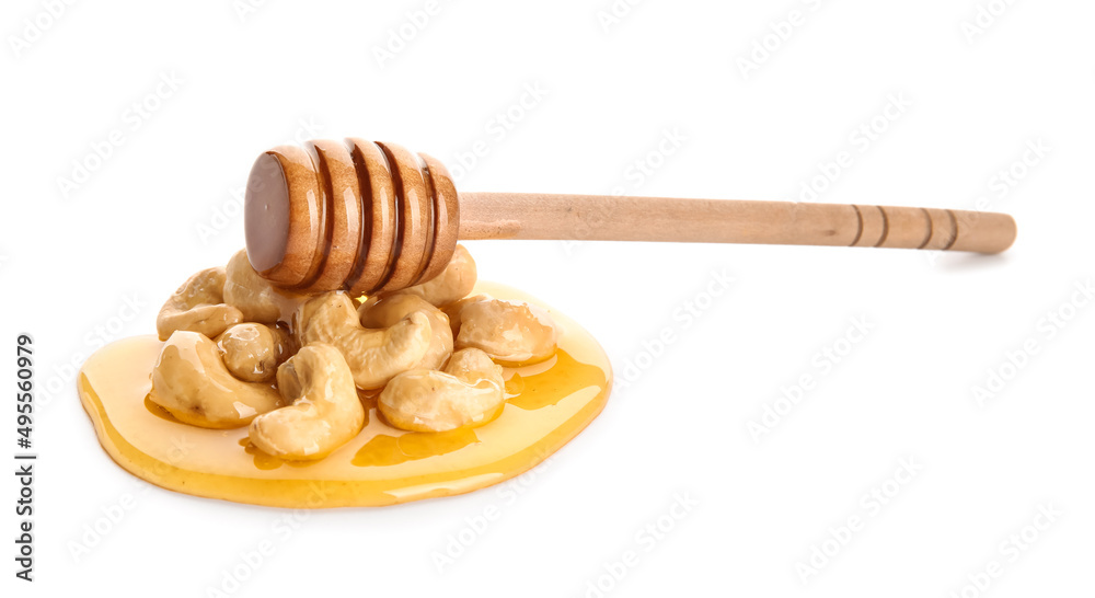 Tasty cashew nuts with honey and dipper on white background