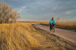early spring afternoon on a biking trail with a senior cyclist riding a gravel bike - Poudre River Trail in Fort Collins, Colorado
