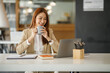 © David - Beautiful young smiling Asian businesswoman working on laptop and drinking coffee, Asia businesswoman working document finance and calculator in her office.