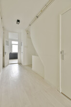 A Long Spacious Corridor Leading Inside The Cozy House