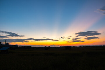 Wall Mural - Colorful sunset and sunrise with clouds. Blue and orange color of nature. Many white clouds in the blue sky. The weather is clear today. sunset in the clouds. The sky is twilight.