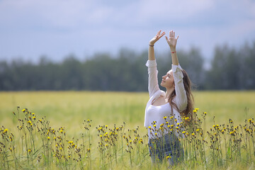 Wall Mural - autumn field girl health / beautiful young model, landscape in a summer field, cute happy model