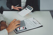 © itchaznong - Banker or Agent calculate price for buy or loan house and showing to customer. Real Estate concept.