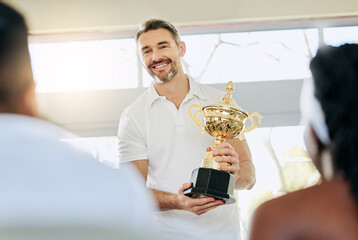 Sticker - Youve earned this. Cropped shot of a handsome mature tennis coach standing with a trophy in the clubhouse during prizegiving.