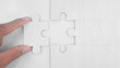 © violetkaipa - Connecting jigsaw puzzle in hand. Business solutions success and strategy concept