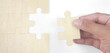 © violetkaipa - Connecting jigsaw puzzle in hand. Business solutions success and strategy concept