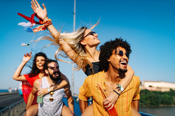 group of friends having fun time at music festival