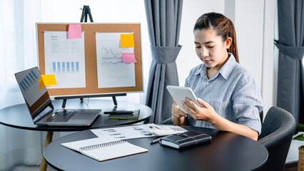 Poster - Business woman looking on tablet to checking email and reply information to boss while reading business chart