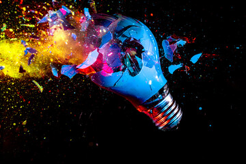 Wall Mural - colorful electric light bulb exploding