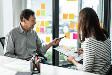 Poster - Business team pointing on keywords in sticky notes and business report to brainstorming about planning strategy