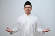 Asian man smiling happy to greeting during Ramadan celebration with both arms open