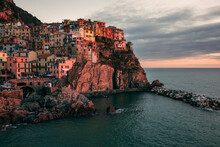 View Of The Town Of Manarola By The Sea In Italy At Sunset