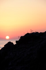 Wall Mural - A nice landscape and sunset from the  rocky coast of Batz-sur-Mer. March 2022, la Govelle Beach, France.