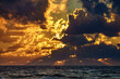 Sunset over sea, stormy clouds