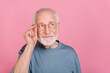 Photo of old grey hairdo man look empty space wear blue shirt isolated on pink color background
