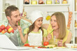 © aletia2011 - family cooking together at kitchen table