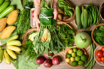 Wall Mural - Organic Southeast Asian vegetables and fruits from local farmer market in summer season, Northern of Thailand, Sustainability concept, Table top view