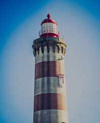 Canvas Print - Vertical shot of a lighthouse in the background of the sky.