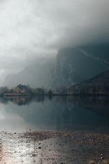 Canvas Print - Vertical shot of Lago di Toblino in autumn. Lake in Trentino, Italy.