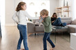 © ADDICTIVE STOCK - Sibling fighting over toy in living room