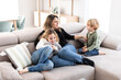 © ADDICTIVE STOCK - Mother with kids on couch