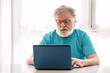 © ADDICTIVE STOCK - Elderly man with laptop at home