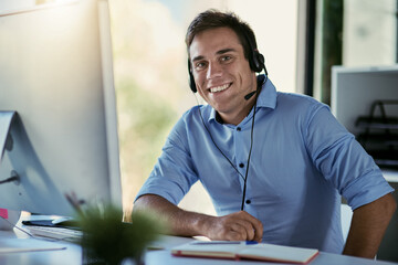 Aufkleber - Hes standing by to take your call. Portrait of a call centre agent working in an office.