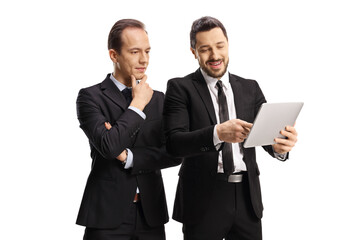 two professional men looking at a digital tablet