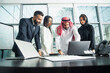 © Ramzi - Multiethnic corporate business team meeting in the office for a strategic marketing plan - Office workers, entrepreneurs, and company employees at work in a multinational company