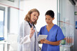 © Daniel Laflor/peopleimages.com - I want you to do the following.... Shot of a female doctor giving a nurse instructions at a hospital.
