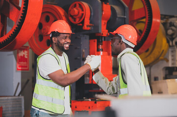 Teamwork African American worker in the factory.Black man afro work heavy industrial