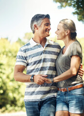 Poster - Committed and content. Cropped shot of an affectionate mature couple enjoying a day in the park.