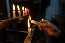 Lighting A Candle In A Church