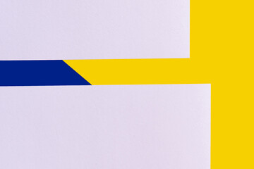 Poster - light lavender paper sheets on blue and yellow background, ukrainian concept.