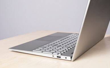 Leinwandbilder - Open laptop at desk. Using computer for online education and work, social communication, leisure, shopping and booking. High quality photo