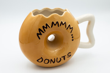 Sticker - Close-up shot of a cute donut-shaped mug isolated on a white background